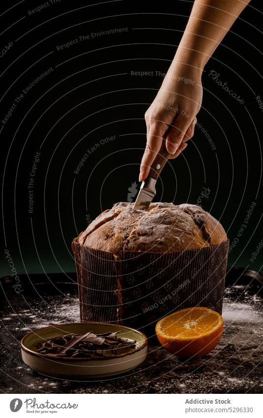 Chef cutting a delicious Panettone, a famous italian christmas cake panettone bread food bakery holiday traditional tasty pastry dessert sweet fresh cuisine