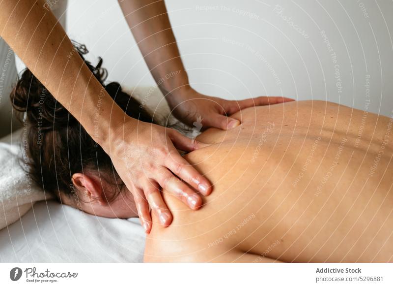 Woman Undergoing A Relaxing Back Massage by Stocksy Contributor