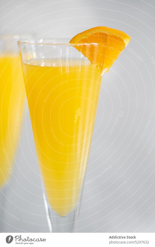 Mimosa cocktail in the glass alcohol alcoholic background beverage champagne champagne glass close up concrete crystal day drink drinking elegance gourmet grey