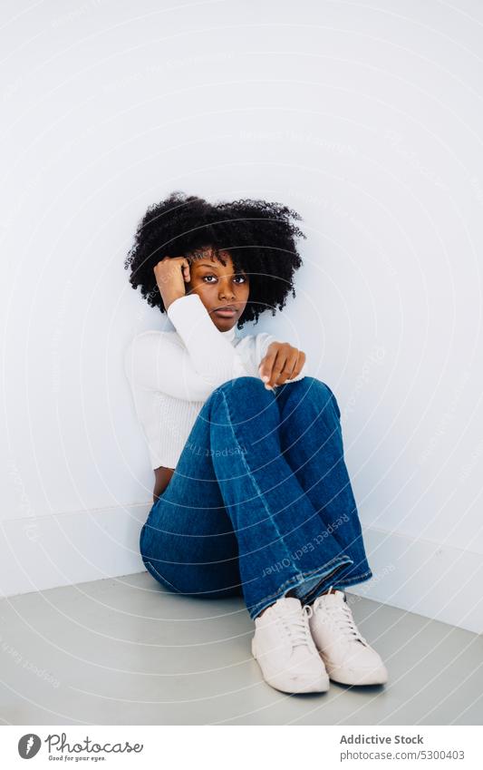 Confident black woman with afro hair style looking at camera