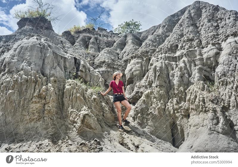 Woman in hat admiring picturesque scenery of desert woman traveler sandstone canyon hill admire hike colombia female tatacoa tourism adventure trip explore