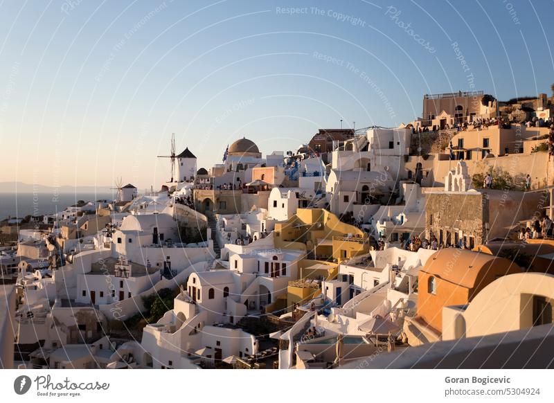 Oia village on Santorini island in Greece at sunset white town oia tourism sea greece europe architecture greek aegean mediterranean travel cyclades landmark