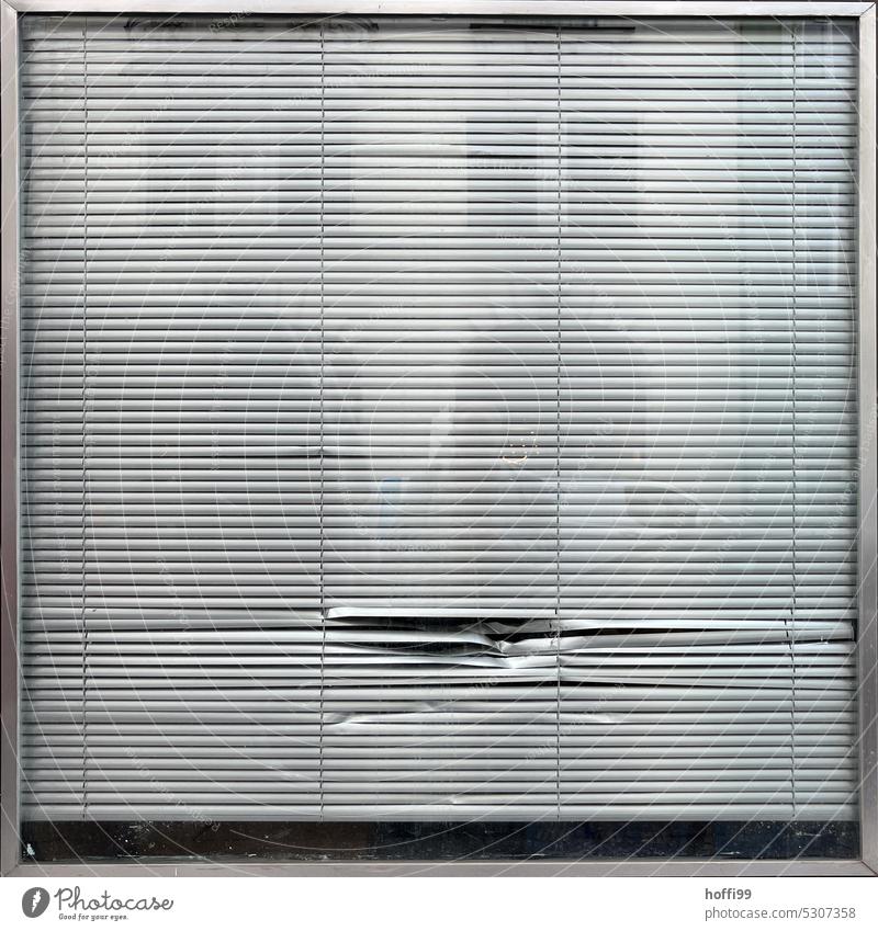 Dents in slats - temporarily closed dents Slat blinds Closed Window Empty Vacancy Gloomy Old Gray Retro Hideous Venetian blinds Roller blind Line Simple