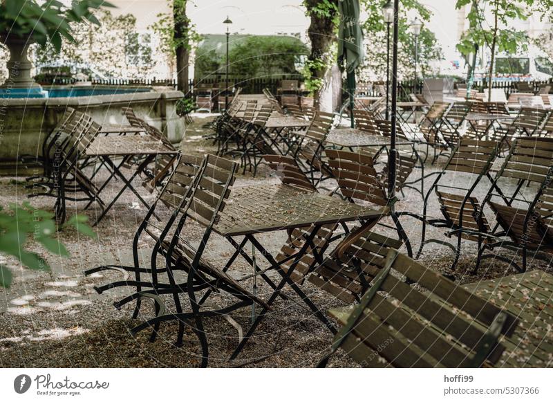 closed beer garden with flowers without people Beer garden beer garden season Gastronomy Table Chair Empty Closed Exterior shot Restaurant Summer Folding chair