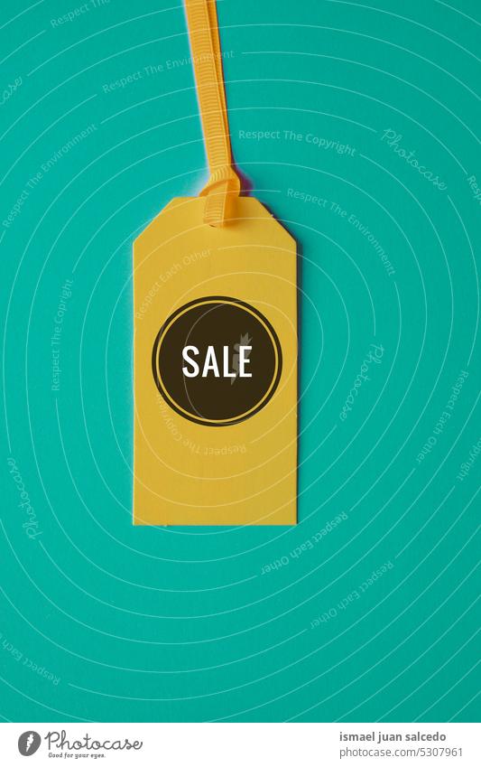 sale word on the yellow price tag for sales blue background mockup object market shopping buy label business black friday yellow tag yellow mockup discount