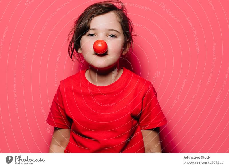 Funny girl in red casual shirt and beret making superhero pose while  looking at camera - a Royalty Free Stock Photo from Photocase