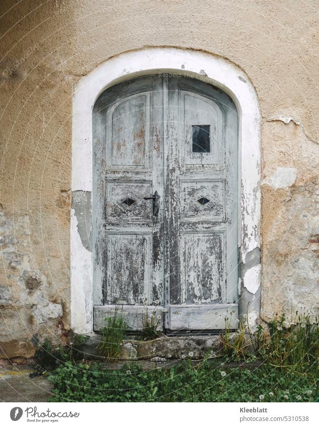 Sad old door in archway - old masonry Old Double gates Double doors Goal Closed old archway old wall Facade Architecture Building Exterior shot Grass Decline