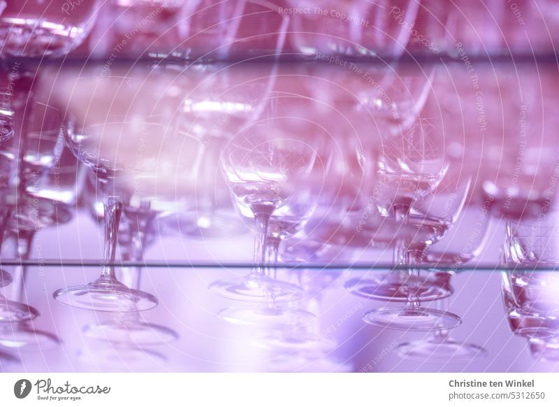 Bathed in pink light, the glasses are on the shelf Glasses Liqueur glasses Glittering Bar cabinet Glass top Reflection Transparent Light Drinking glasses