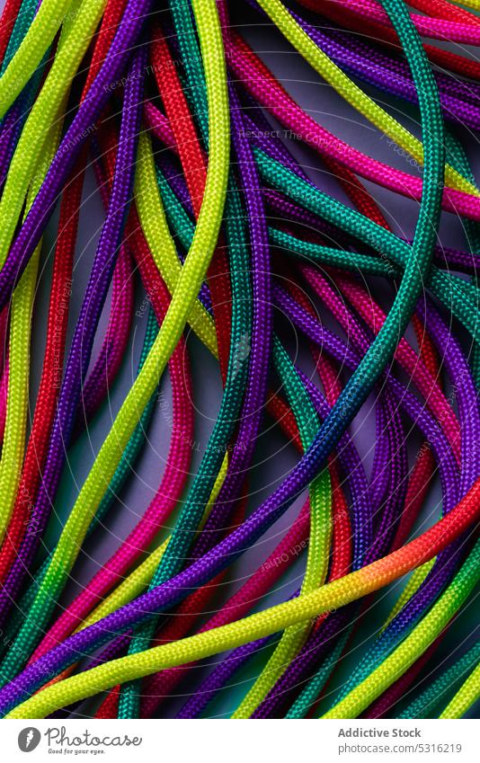 Vibrant colorful laces in pile rope twine vibrant multicolored vivid bright layout string mix shoelace cord fabric spectrum fiber untied art material minimalist