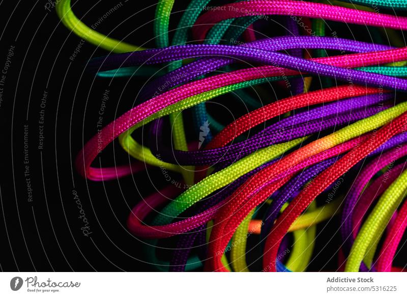 Vibrant colorful laces in pile rope twine vibrant multicolored vivid bright layout string mix shoelace cord fabric spectrum fiber untied art material minimalist