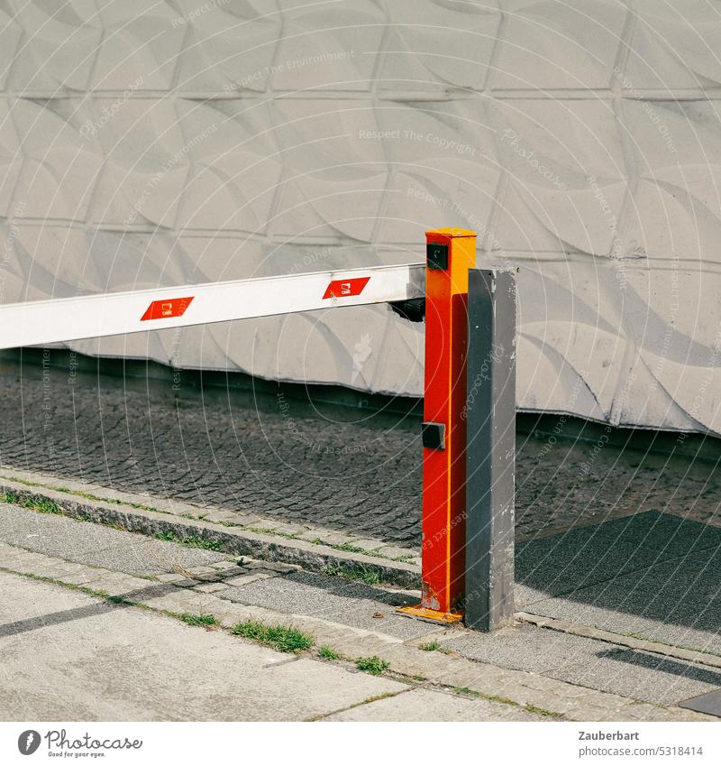 Barrier with red post in front of white wall made of concrete moldings Control barrier Pole Red Wall (building) Concrete Fittings lock passage forbidden open
