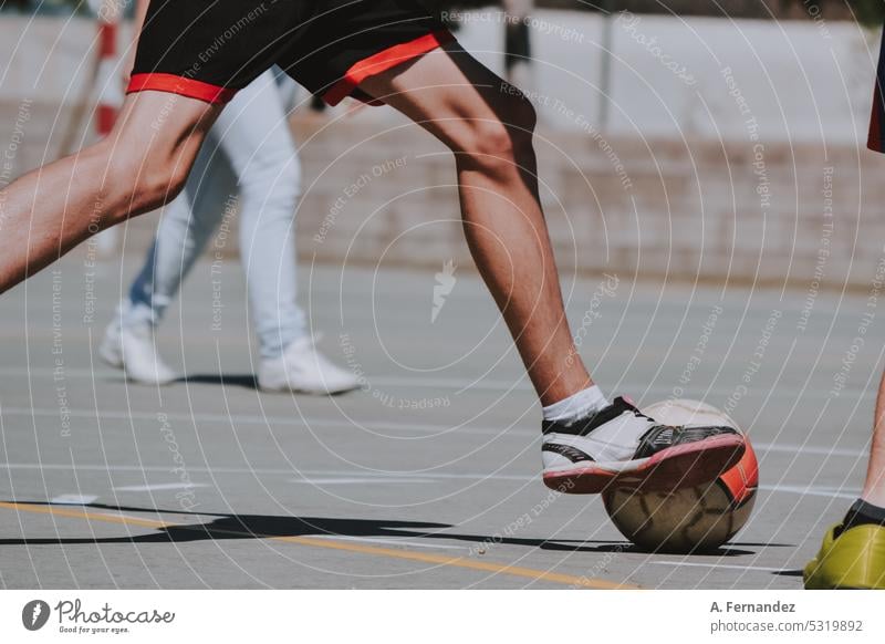 Detail of a teenager kicking a soccer ball during a match. soccer field football Football boots Soccer training Soccer player soccer game goal teenagers Recess