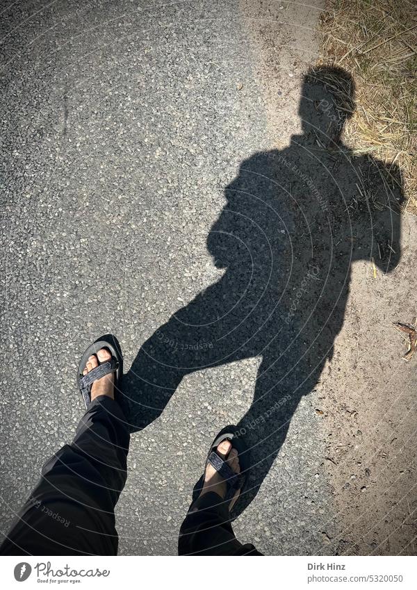 Own shade with a view of the street Shadow shadow cast Sunlight Silhouette Contrast Light and shadow Exterior shot Colour photo Feet on the ground Sandals