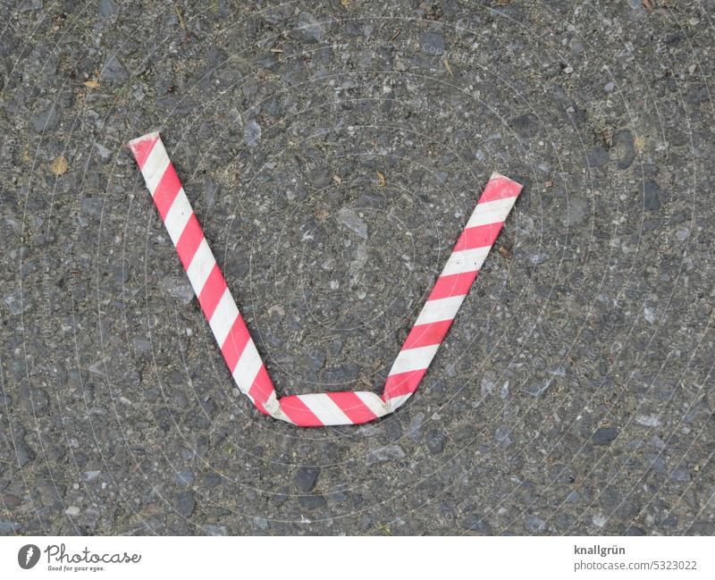 Bent drinking straw Straw Striped waste buckled Bend Ground jettisoned Environmental pollution Trash Throw away Street Dirty Dispose of Environmental protection
