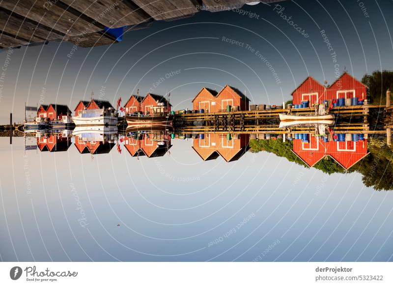 Fishermen huts reflected in a rotated image II Red Central perspective Light (Natural Phenomenon) Dawn Morning Day Sunlight Sunbeam Sunrise Deep depth of field