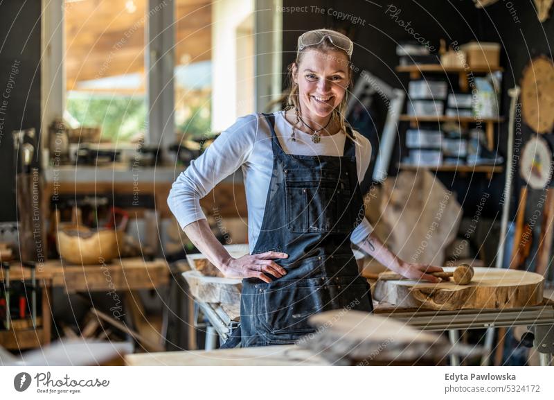 Portrait of confident craftswoman in her workshop real people woodshop carpenter entrepreneur expertise craftsperson creativity manufacturing crafts people