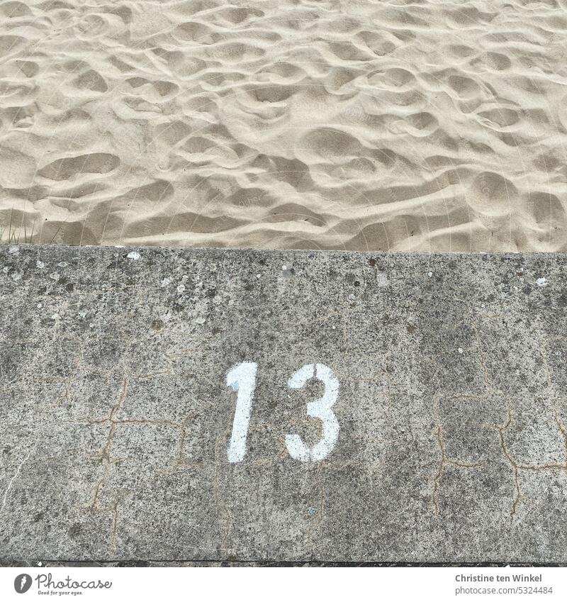 Beach section 13 Digits and numbers Sand Lanes & trails Copy Space top Signs and labeling Structures and shapes Pattern Sandy beach Vacation & Travel Relaxation