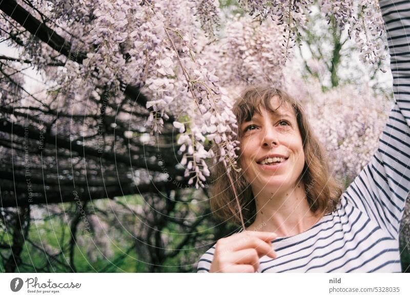 Favorite hairstyle - flowers in the hair portrait Young woman Woman pretty Face naturally Authentic Face of a woman laughing Laughter fortunate floral Happiness