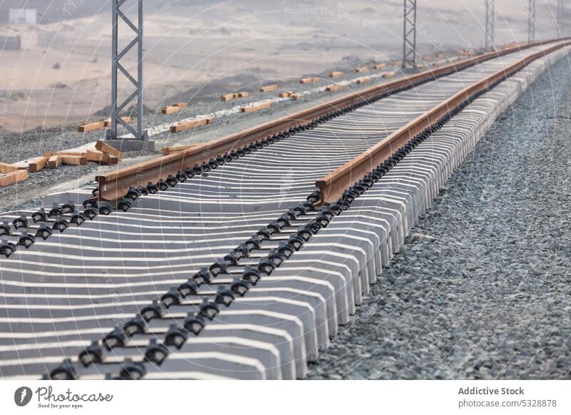 Laying of railroad tracks in progress concrete cement railway construction nature infrastructure terrain development environment industrial grass line modern