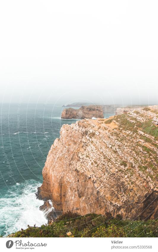 Cape Cabo de Sao Vicente in the southwest of Portugal in the Algarve region. Watching the rocky cliffs. Wandering of Fisherman Trail cape cabo de sao vicente