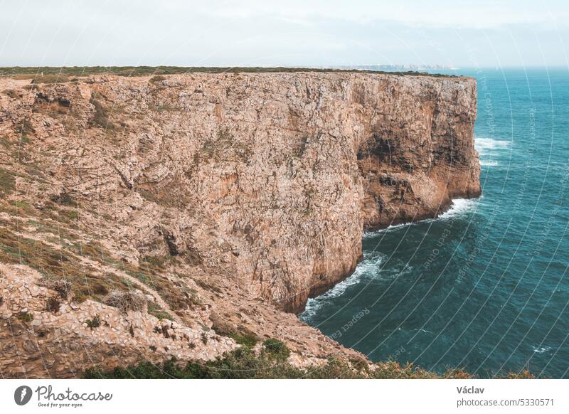 Cape Cabo de Sao Vicente in the southwest of Portugal in the Algarve region. Watching the rocky cliffs. Wandering of Fisherman Trail cape cabo de sao vicente