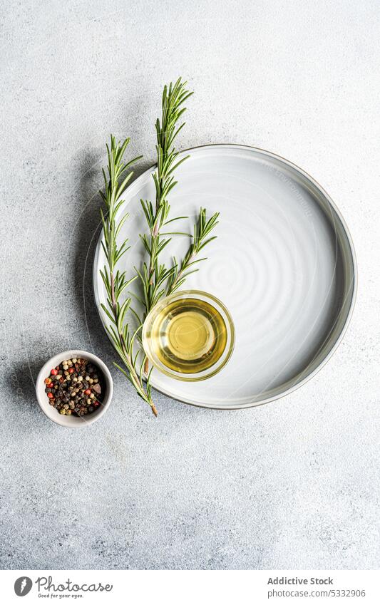 Cooking concept with rosemary herb food ingredient spice background board bowl bread bread stick cook cooking copy space gourmet kitchen oil overhead pepper