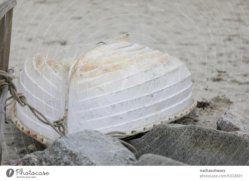 Old boat on the beach Water Loneliness Calm Watercraft Gray Subdued colour stones Sand Sandy beach bank Structures and shapes silent tranquillity Retirement