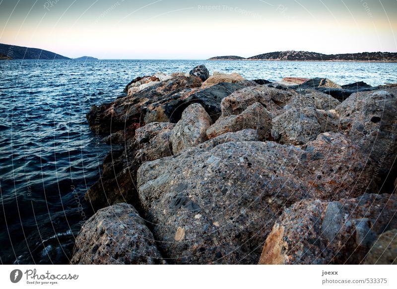 At the end of the road. Vacation & Travel Ocean Island Nature Landscape Water Sky Cloudless sky Horizon Summer Beautiful weather Coast Crete Stone Blue Brown