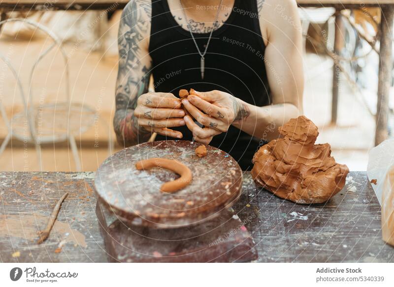 Man creating clay pot on wheel man pottery artisan workshop shape craft creative skill ceramic small business handicraft handmade process professional