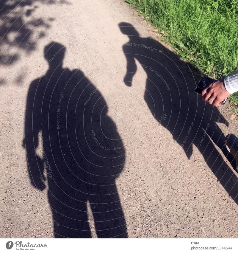 nature walk Silhouette Going sunny Shadow Perspective hike Hand Meadow Gravel path Swing In transit Landscape out