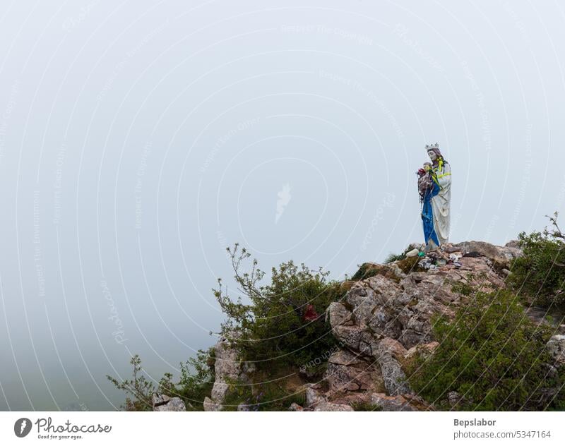 Statue of the Virgin Mary on the top of the Pyrenees mountains cloud jesus christ mary religion sculpture statue faith holy mother religious christian virgin