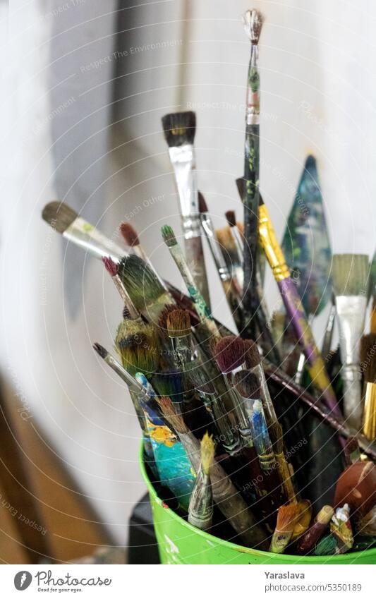 photo of a paint brush in a bucket artist many tool colours artistic paintbrush background design acrylic creativity education painter painting creative