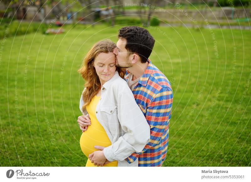 Young family is expecting a baby. Happy couple of parents-to-be