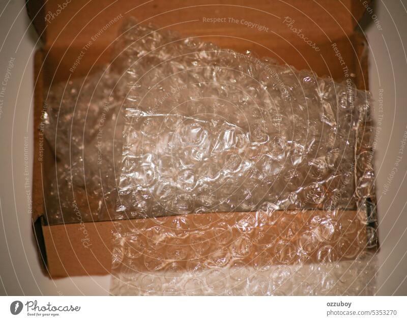 empty of cardboard box with bubble wrap material plastic texture background package safety transparent abstract air pattern cargo delivery pop post protection