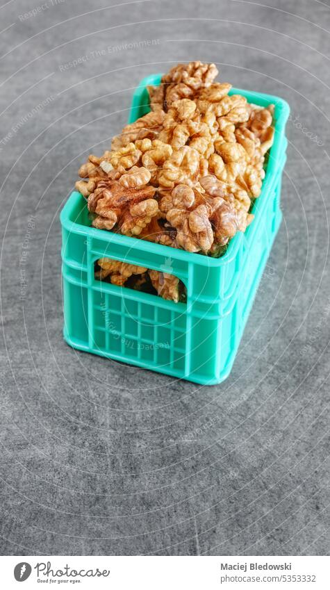 Close up photo of walnuts in miniature container, selective focus. close up delicious diet snack food healthy ingredient natural