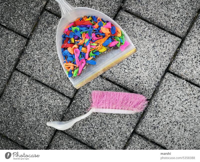 party is over I Party End Trash balloon balloons Sweep Tidy up Broom Childrens birthsday water bombs out variegated Multicoloured Colour photo Cleaning