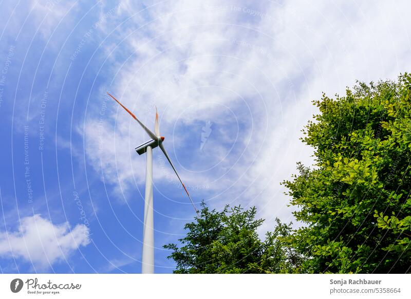 A wind turbine against a blue sky Wind energy plant Sky Energy industry Renewable energy Pinwheel Electricity Eco-friendly Alternative Technology Ecological