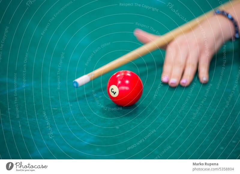 Billiard game playing billiard hand ball cue chalk table green object leisure challenge aiming holding sport equipment competition club stick game equipment