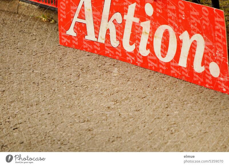Action. is written in white on a red sign quote special offer Special sale Market stall Markets Blog temporary Cheap offer Retail sector Save Action discount