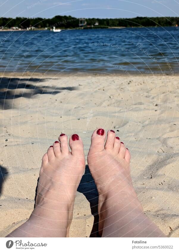 The legs as white as the sand on the beach, the nail polish as red as blood and the water of the lake as blue as... well, blue. Legs feet Feet Toes Toenail