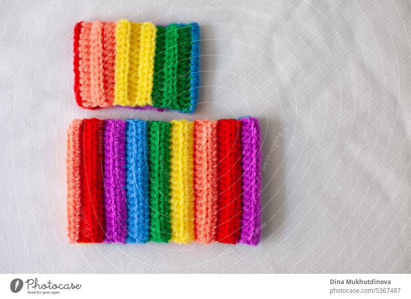handmade crocheted rainbow bracelets as symbol of pride month isolated on white background. Celebrating Pride month with symbol colors of lgbt abstract art
