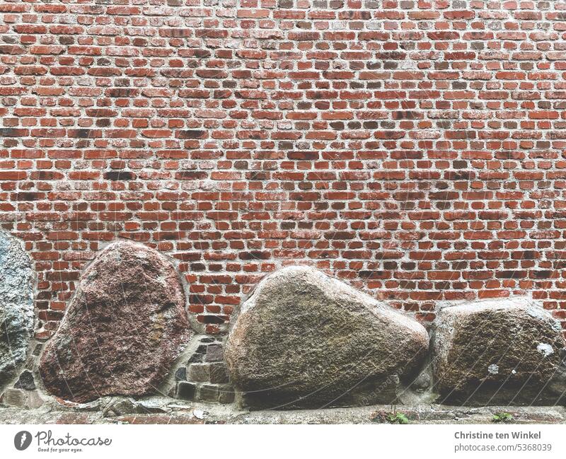 The old brick facade of a church with incorporated boulders Wall (barrier) Facade Old stones Red Bricks Boulders Clinker bricks sandstones Building