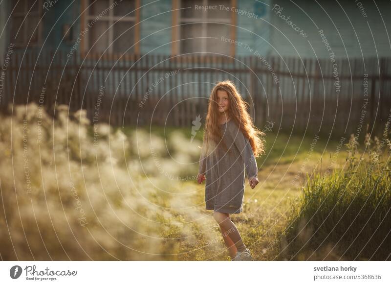 Girl long hair red natural wood fence house sunlight Printing sensation Curiosity Love of nature Sunlight Contentment Touch Agriculture Nature red hair