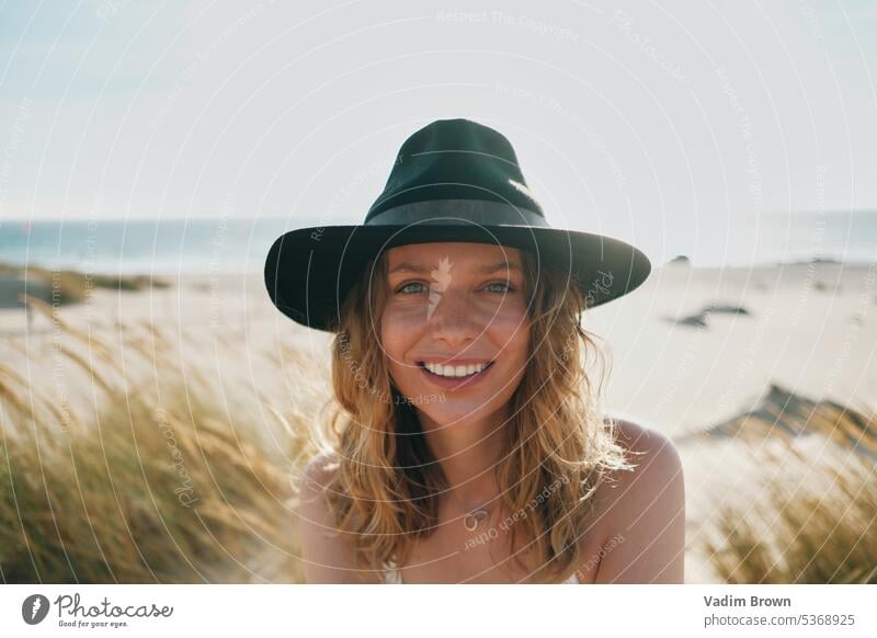 portrait of a woman in the hat beach girl sea summer vacation water beauty sun travel people ocean body sand leisure holiday fashion tropical lifestyle