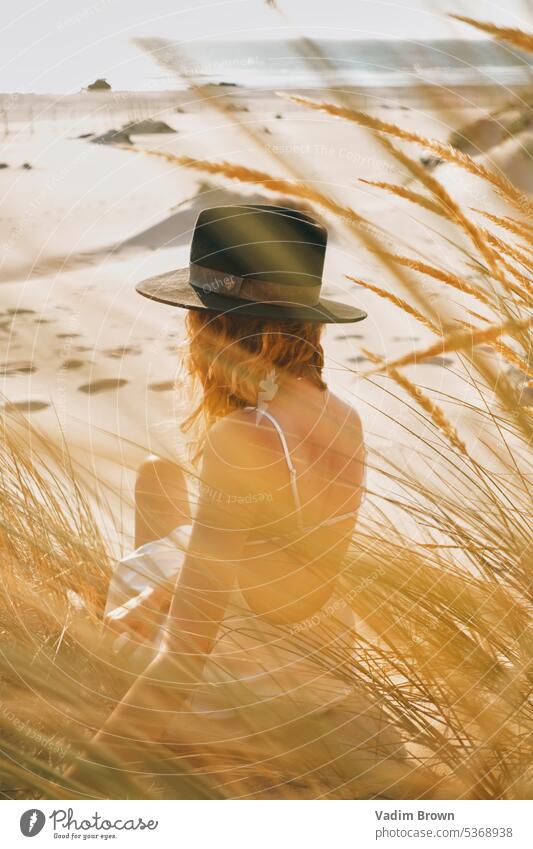 portrait of a woman in the hat beach girl sea summer vacation water beauty sun travel people ocean body sand leisure holiday fashion tropical lifestyle