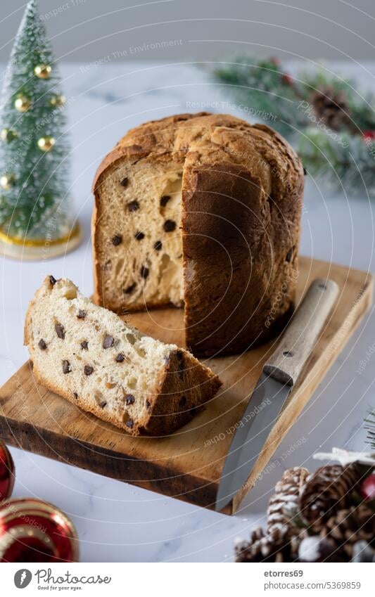 Christmas cake panettone on white marble baked breakfast chocolate christmas christmas.background delicious dessert food holiday homemade italian pastry ribbon