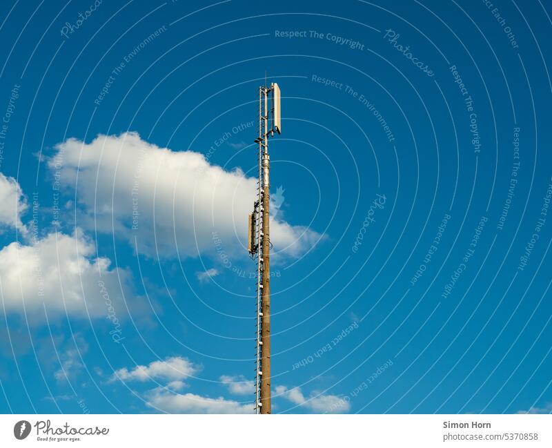 Transmission tower against blue sky Broadcasting tower Mobile communications 5g expansion network coverage Receive Telecommunications Technology Antenna