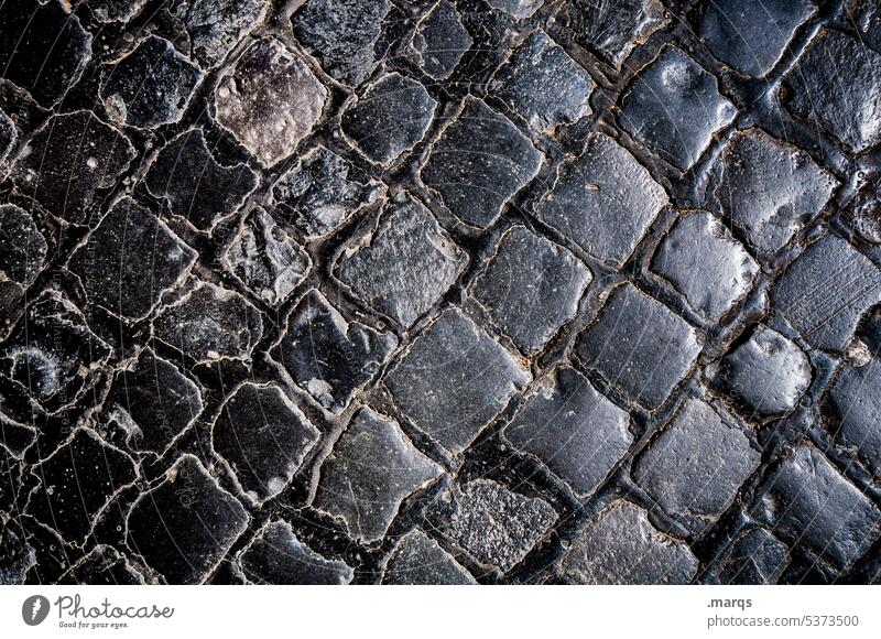 cobblestones Stone Cobblestones Paving stone Street Glittering Black Structures and shapes Tar Close-up Background picture