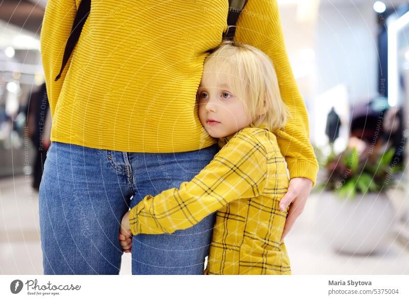 Little boy embrased his mother. Shyness, fears, anxiety. embracing embrace mom love shyness hyper-attachment tenderness child kid separation cuddling dependence