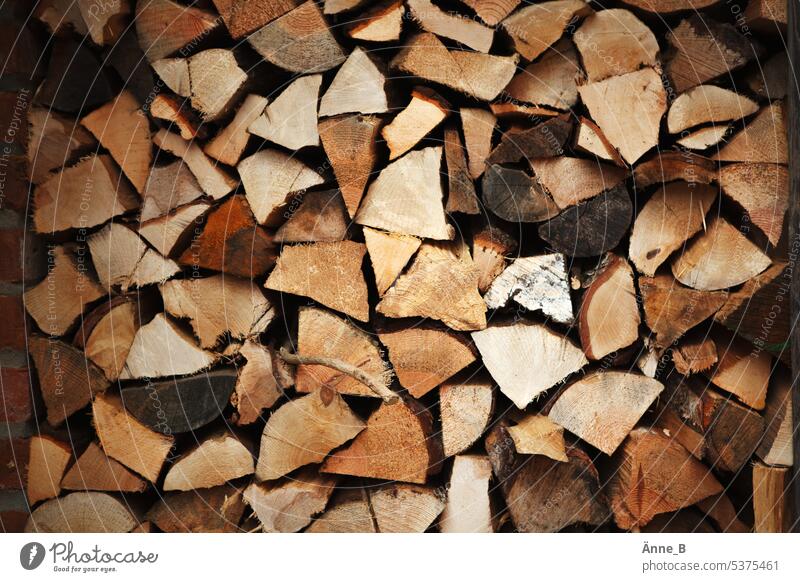 Why does wood crack in the fire? firewood Fireside Winter Winter mood Warmth Heat generation Logs Stack of wood Cozy Anticipation Christmas Supply Wood campfire